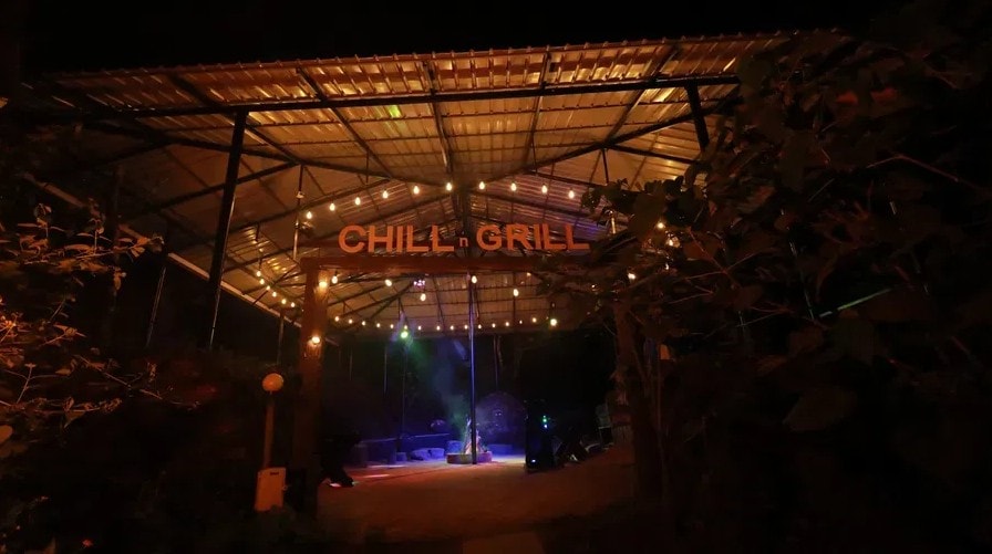 Chill n Grill outdoor venue lit up at night with fairy lights at Holistic Eco-Resort